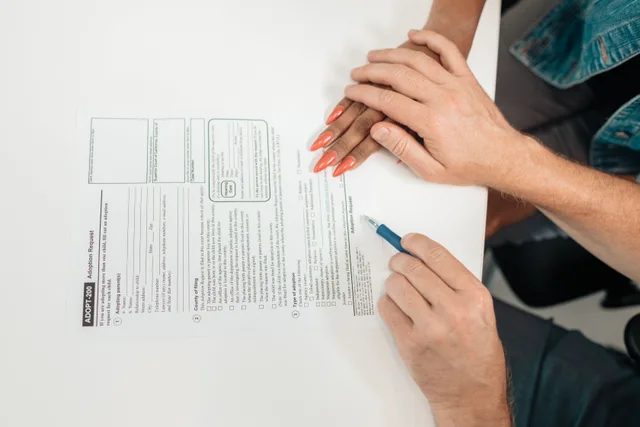 A couple fills out an adoption request form, highlighting commitment and future family planning. Privacy Safe Family Profiles: History, Law and Codes